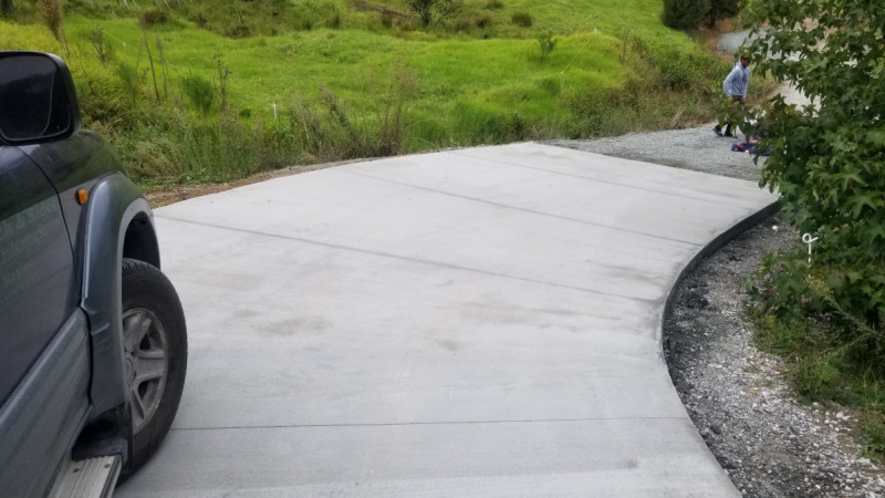 Concrete steep part of 800m driveway repairs after heavy rain