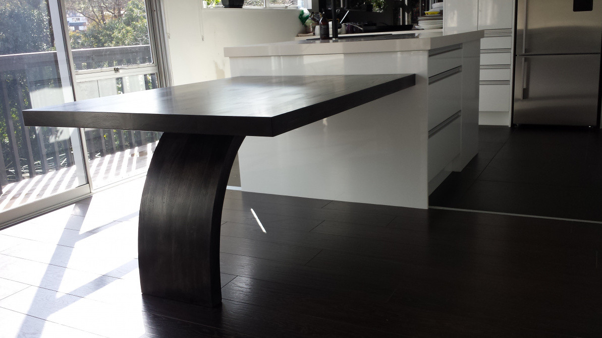table extension to an island , in solid Ash with black stain