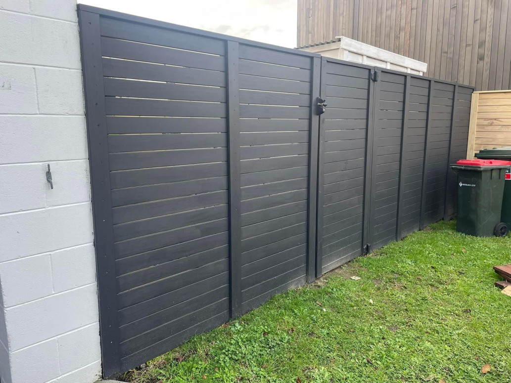 Horizontal slatted pine with exterior gate, soft closing hinges and lockable latch installed. Pt Chev