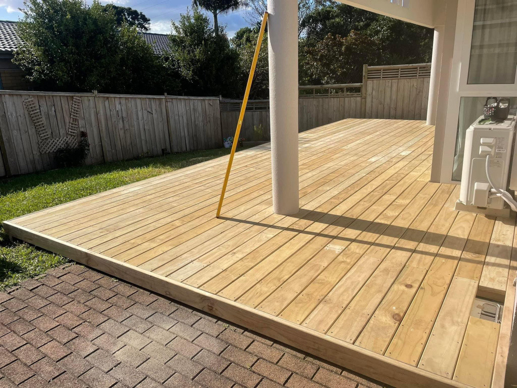 Pine deck built over existing tiles and extended out an extra metre on to lawn. Blockhouse Bay