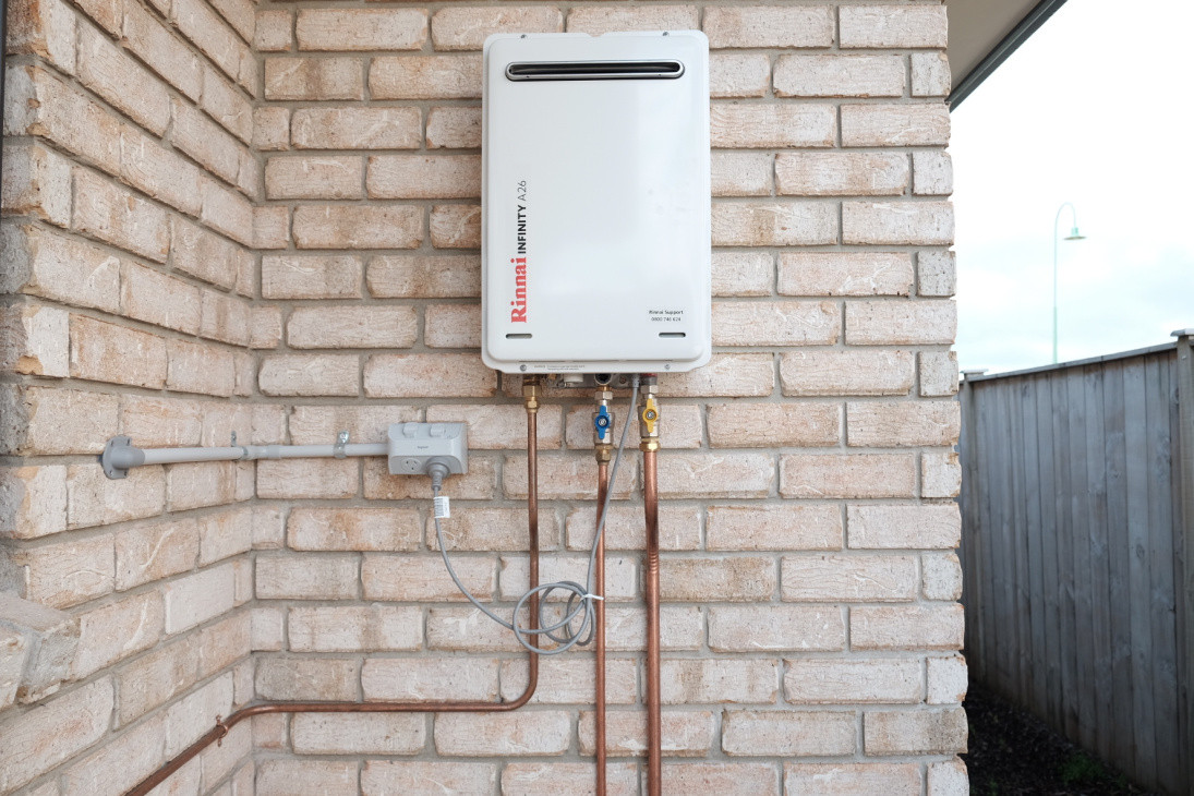 Conversion of a home from electric to gas hot water