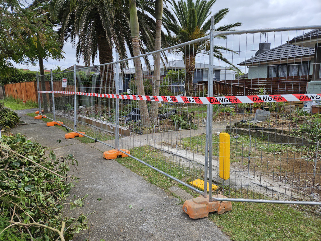 Concrete fence removal by team