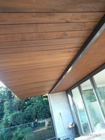 Underside of deck hung to cover timber framing