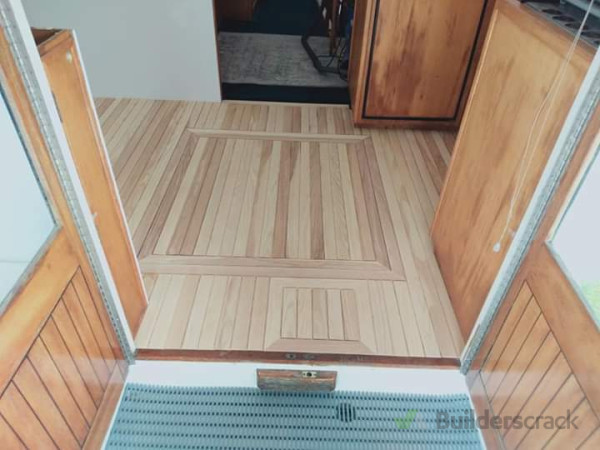 Launch kitchen flooring with engine and water hatches