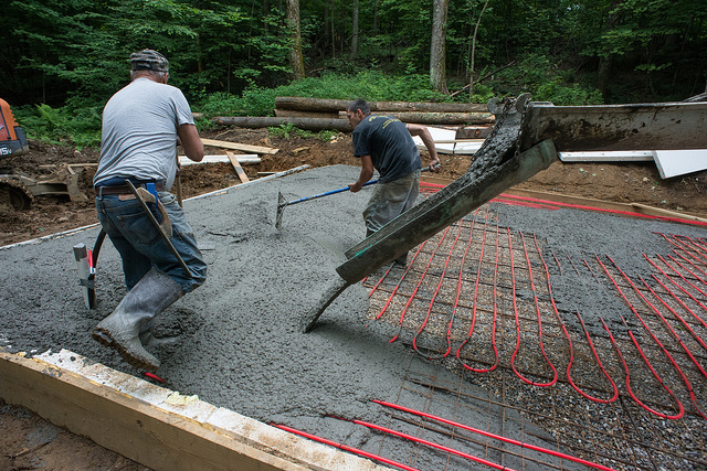 pouring new layer of concrete over concrete