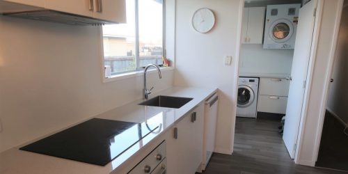 Sleek Splashback Completes Kitchen and Laundry Reno