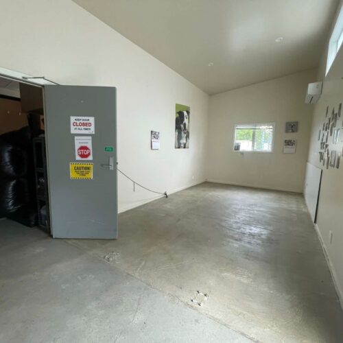 The office with carpet removed from the concrete floor