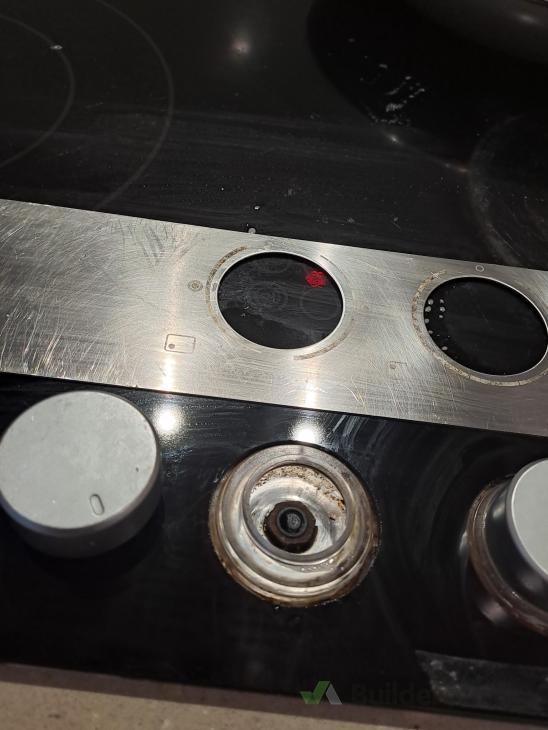 Attach stove top switch and reglue switches template back on again