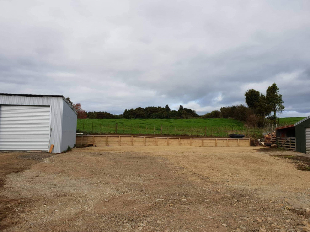 Strip out old trees soil and new retaining wall