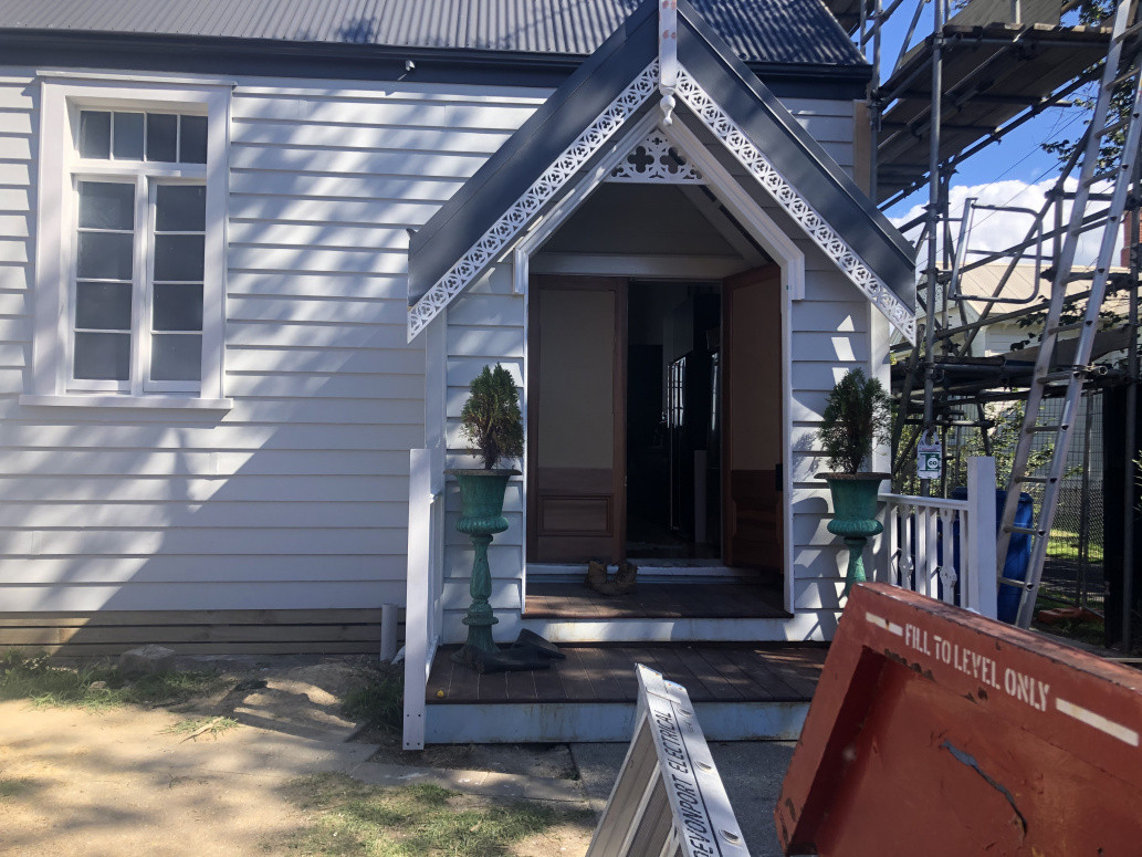 Front entry porch with decorative mouldings and steeple installed. Kwila decking laid tight with a bullnose finish to give an originality look