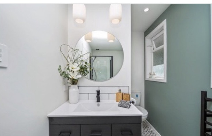 Bathroom - shower, bath, tiles and vanity installed by The Builder
