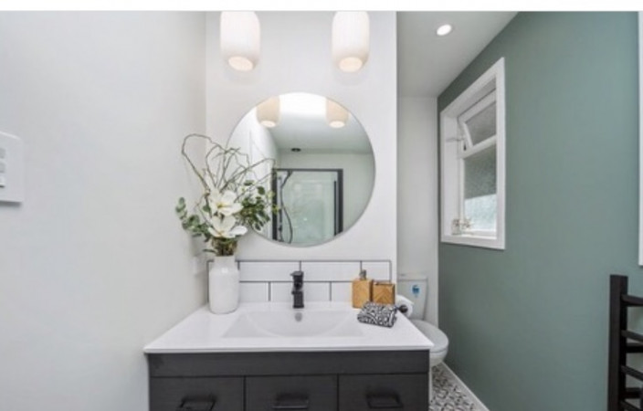 Bathroom - shower, bath, tiles and vanity installed by The Builder