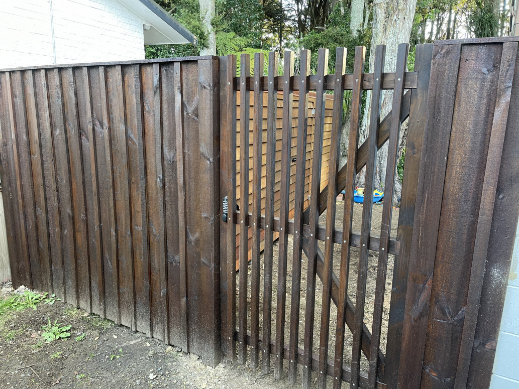 New Stained fence with custom made gate with digital lock  and black hardware