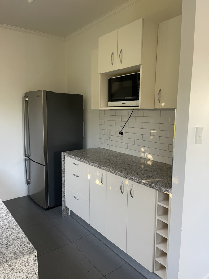 New tiled floor, kitchen unit,  engineered stone benchtop with new fixtures