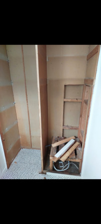Picture of laundary cabinet space prior to renovation.
