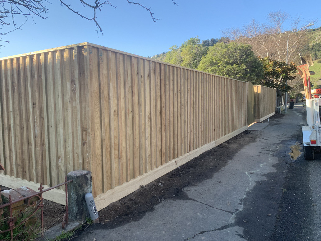 Batton fence rough sawn 25mm paling with dressed kick board and capping.