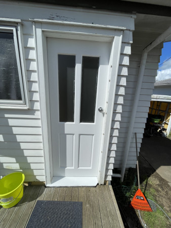 Entrance door replaced and painted.