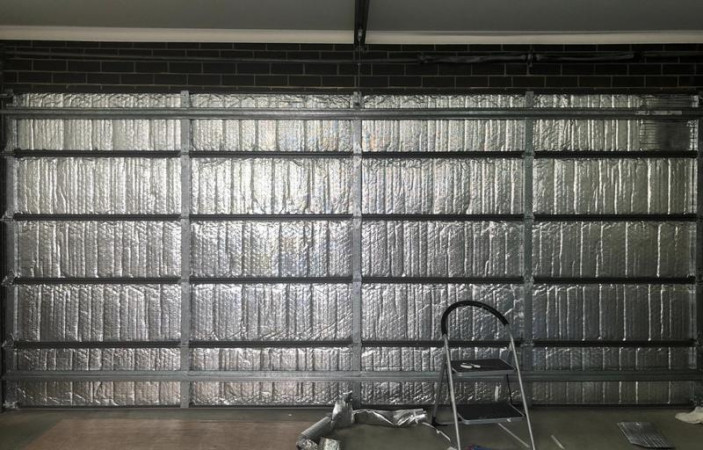 Retrofit insulation to black North-facing garage door to create a liveable home-office space in the garage.