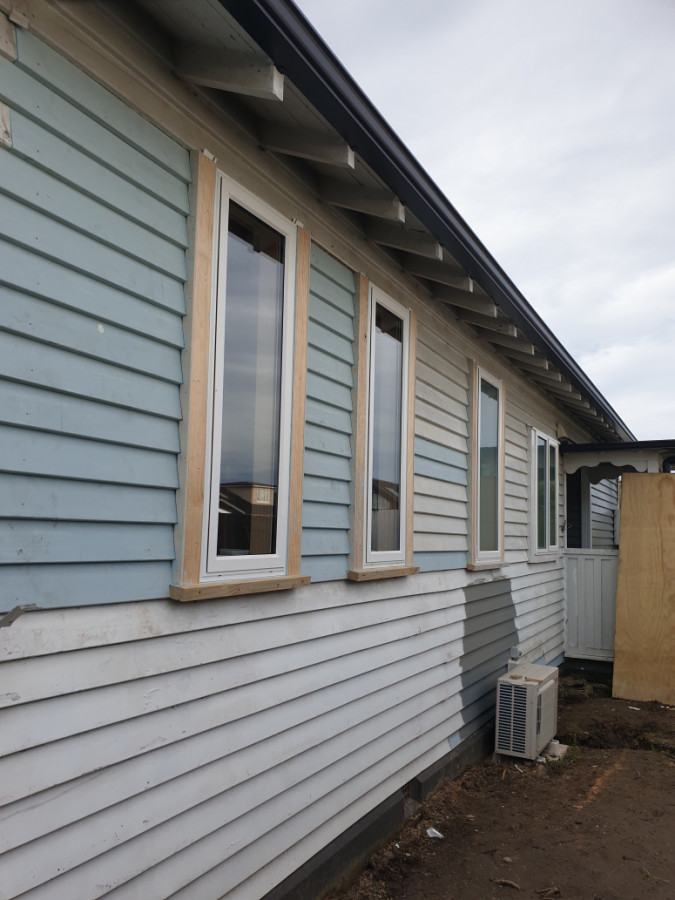 Replace rotten weatherboards and install new double glazing