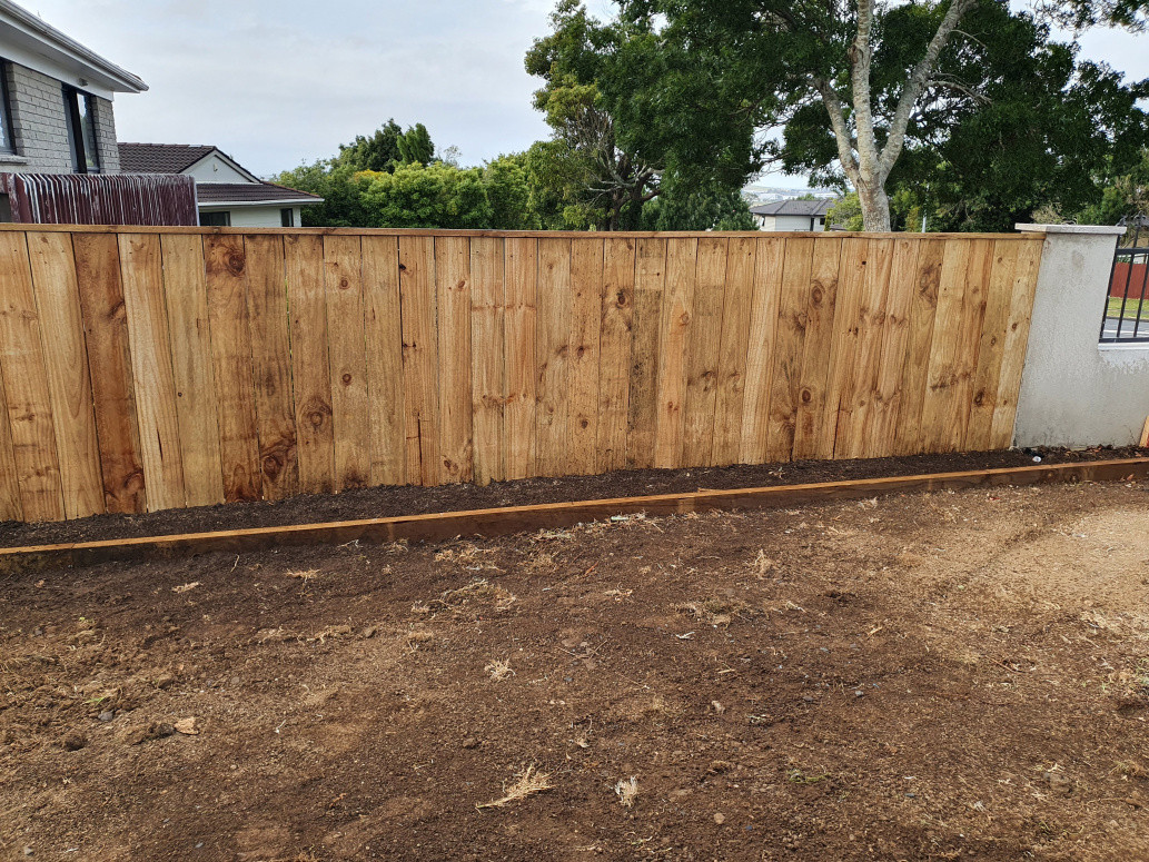 Manukau - Fence with retaining wall and planter edging.
