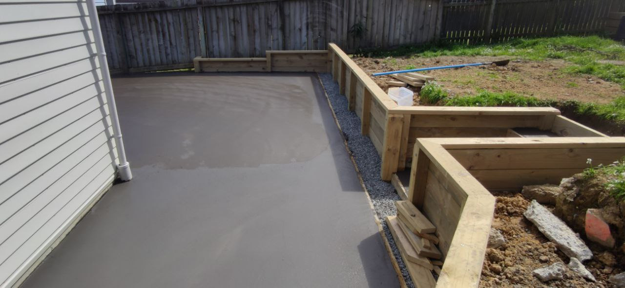 Concrete slab dark tinted and retaining wall