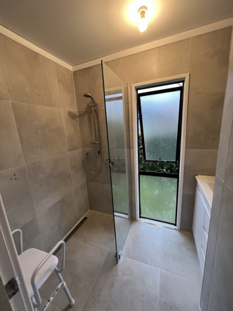 Fully tiled wet area with shower glass screen.