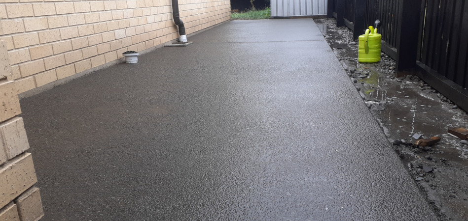 Exposed concrete with waimak stones. Prep and poured following wash off the next day, 5 days later acid washed, then sealed to finish off the job