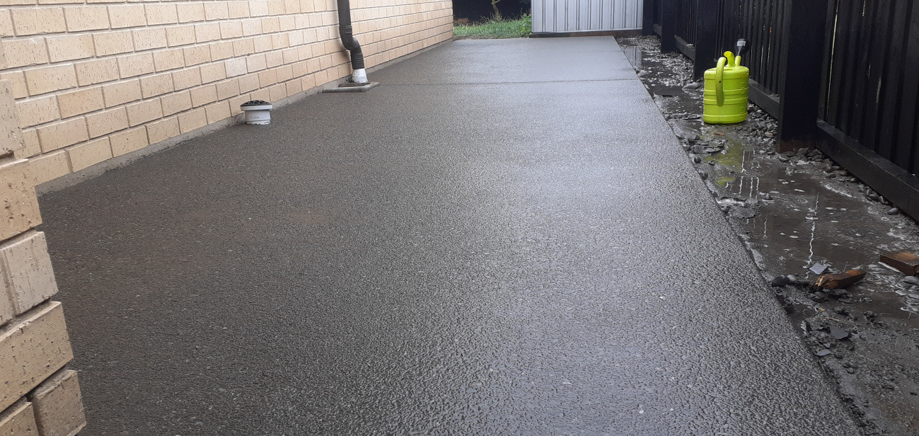 Exposed concrete with waimak stones. Prep and poured following wash off the next day, 5 days later acid washed, then sealed to finish off the job