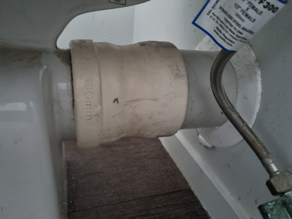 Waste pipe for toilet lifted to correct height and ucon pan connector installed
