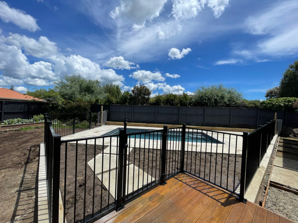 Bisque coloured concrete with black Orbison fencing, with Ox Builders