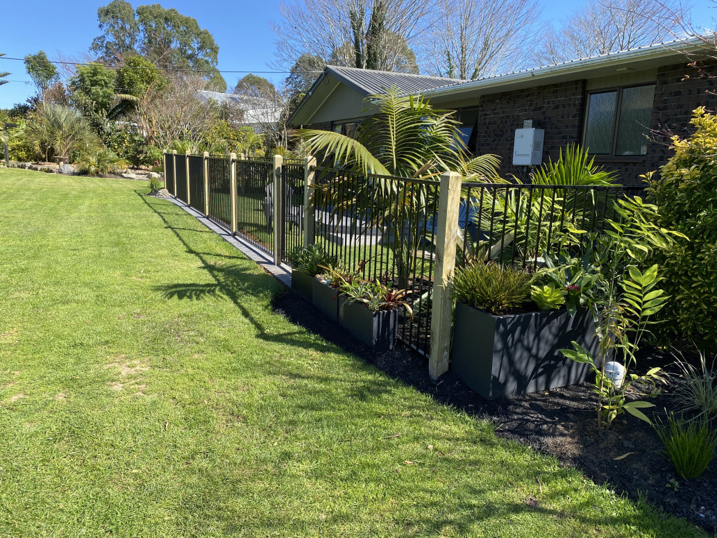 Fence and mowing strip