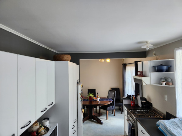 Feature continued into kitchen space. Cabinet wall side High lighted.