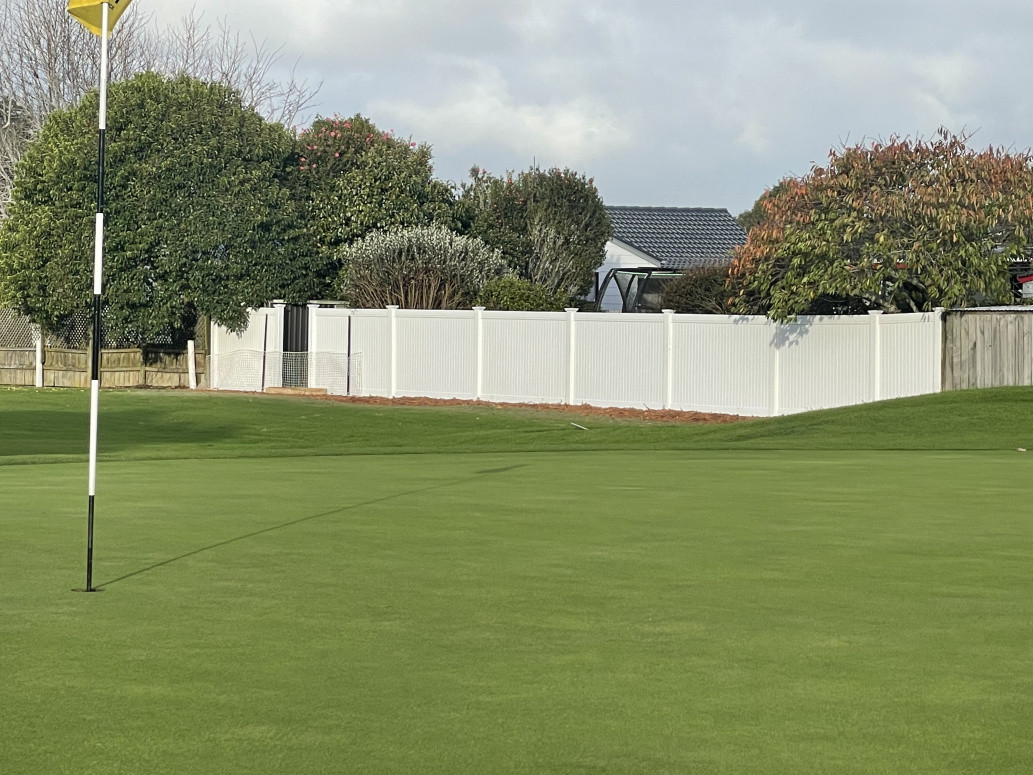 Low maintenance PVC fencing we installed next to the golf course