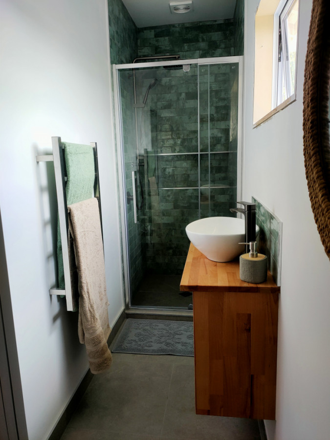 Custom made vanity with tiled shower in a new en-suite