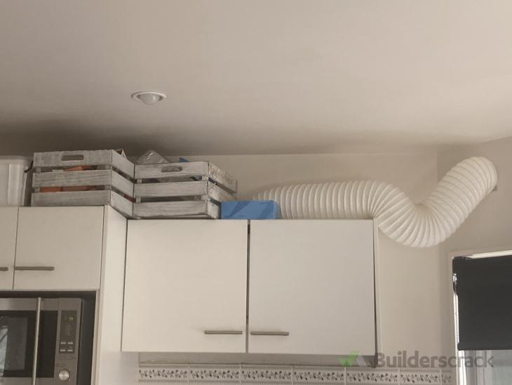 Replace existing cupboard around new extraction fan in kitchen