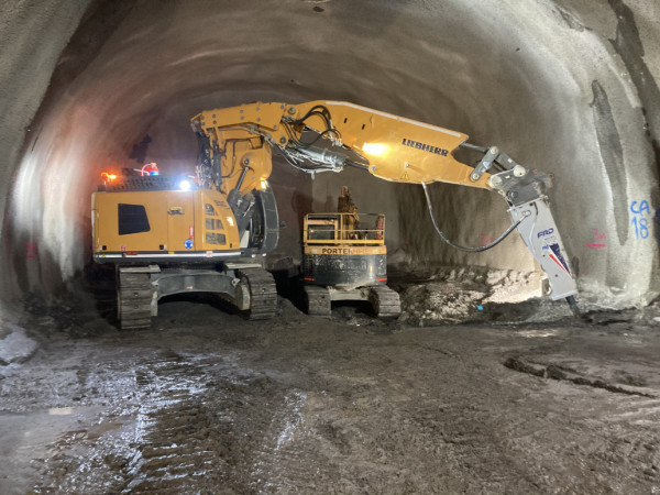 50ton Digger jack Hammering underground tunnel