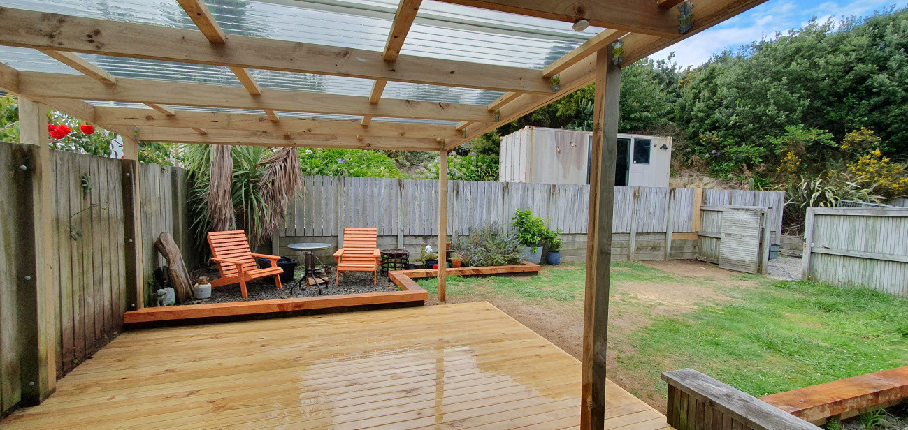 New deck + pergola and macrocarpa sleeper edging ot garden surround