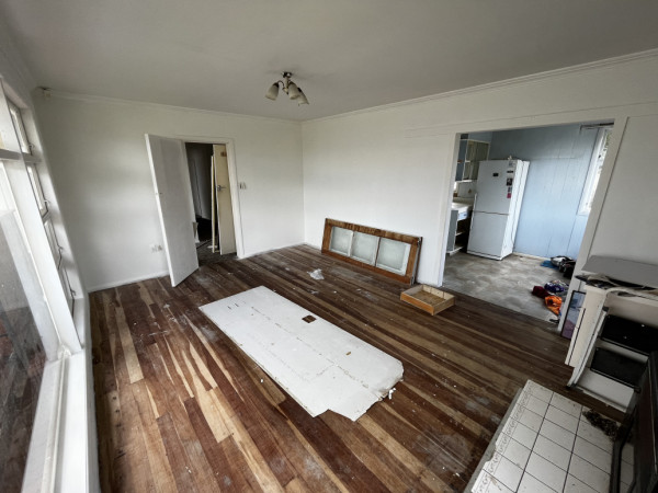 Living room before removing dividing wall to kitchen