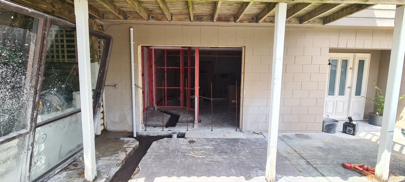 Removal of existing sliding door. Preparing for new window joinery