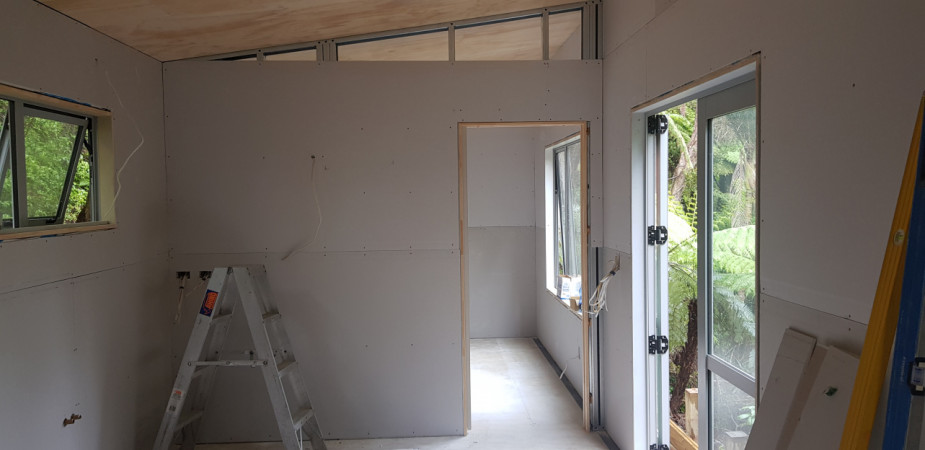 Inside tiny home trailer showing wall and ceiling linings.