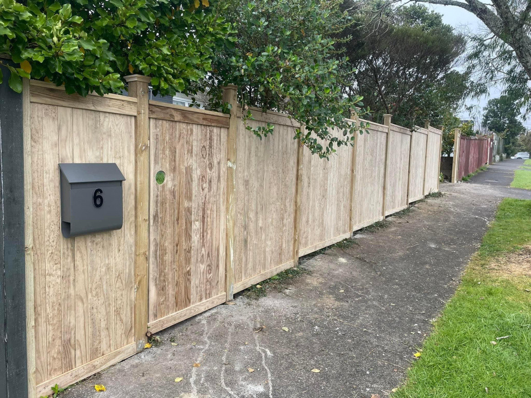 Vertical slatted pine fence. Installed mail box and gate. Blockhouse bay