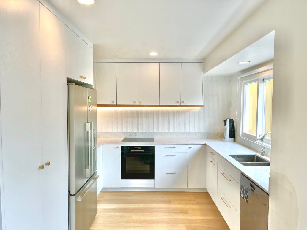 A full kitchen rebuild with back-lit LEDs and white oak veneer timber mouldings