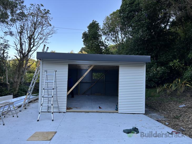 Install a new roller door in kitset garage ( 848282) Builderscrack