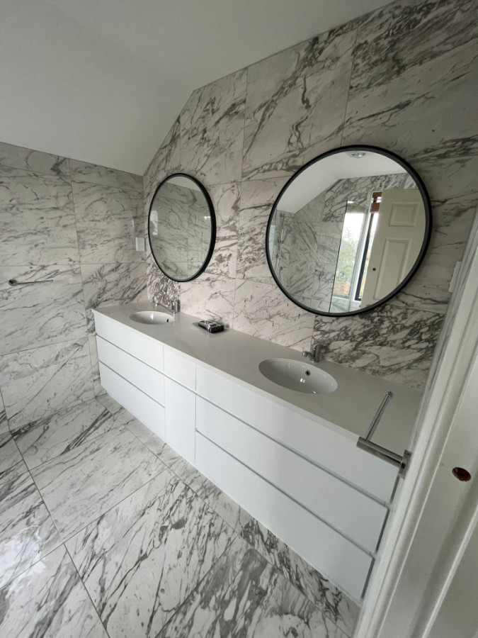 2 vanities in full length cabinetry