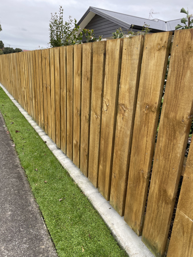 Wooden paling fence and rails