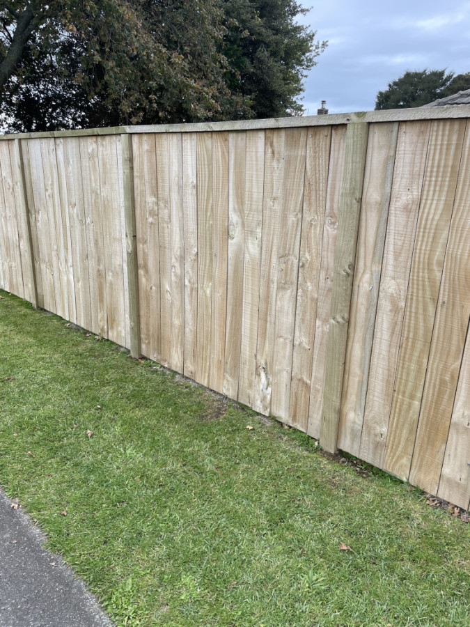 Wooden paling on roadside 1.8 m high