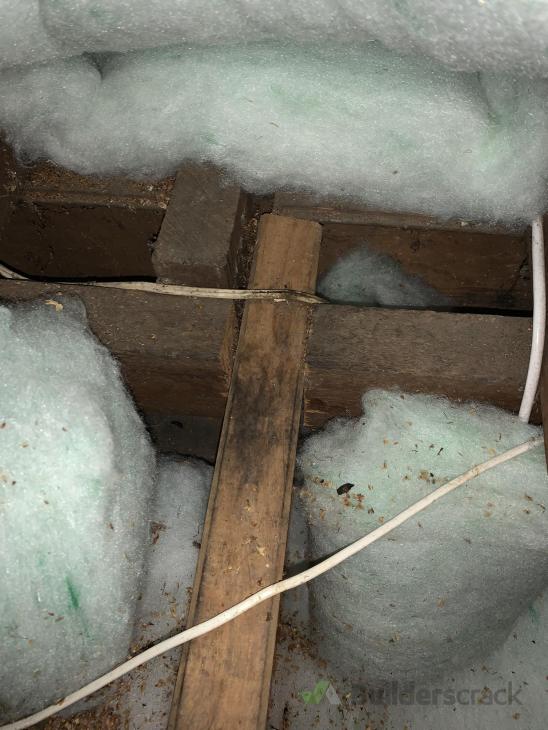 Installing extra beam in attic to support plywood attic flooring