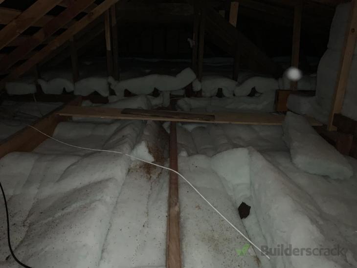 Installing extra beam in attic to support plywood attic flooring