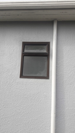 Remove woodrn toilet window, reinstall aluminum with stucco