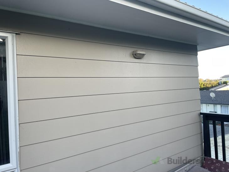 Installing a clothesline into concrete board cladding ( 860443) Builderscrack